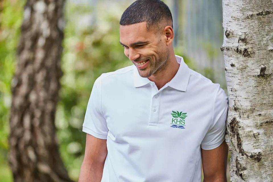 young man in branded polo shirt