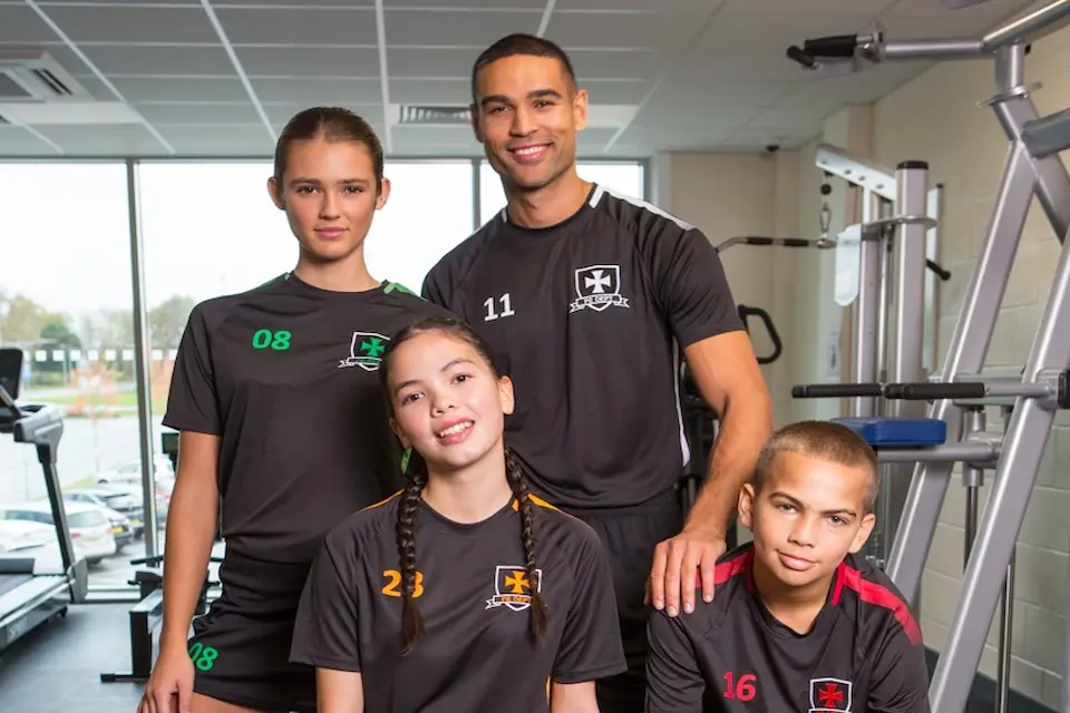 group of youths wearing branded teamwear