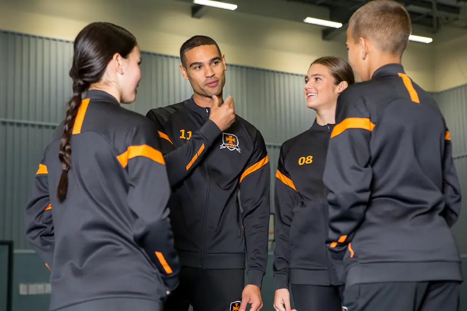 group of youths wearing branded teamwear