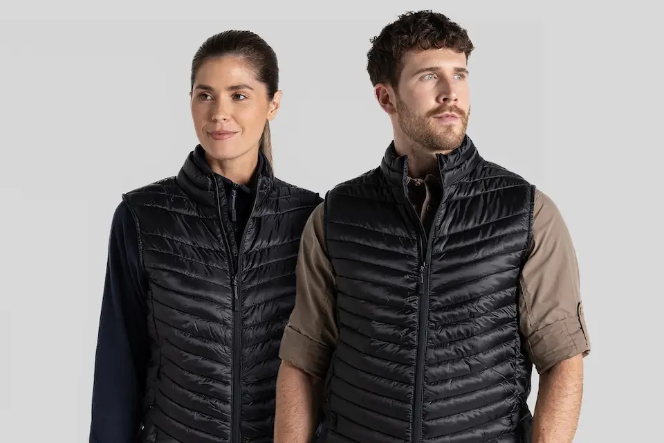 young woman and man wearing branded gillets